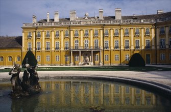HUNGARY, Burgenland, Eisenstadt , Schloss Esterhazy Palace yellow painted exterior seen from across