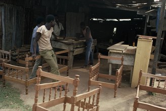 GHANA, Kuniasi, Workers in furniture workshop.