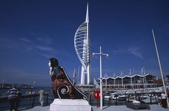 ENGLAND, Hampshire, Portsmouth, Gunwharf Keys. Spinnaker Tower with figurehead in the foreground.