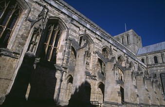 ENGLAND, Hampshire, Winchester, Winchester Cathedral. Angled part view of exterior