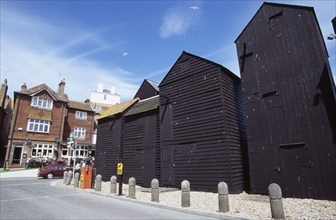 ENGLAND, East Sussex, Hastings, "Tall black wooden huts close to the Fishermens Museum, originally