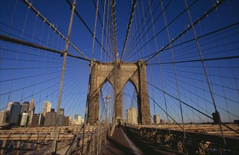 USA, New York, New York City, Brooklyn Bridge.  View along bridge to pedestrians at far end and