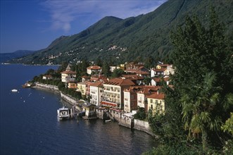 ITALY, Piedmont, Lake Maggiore, Cannero Riviera.  Waterside buildings with red tiled rooftops at