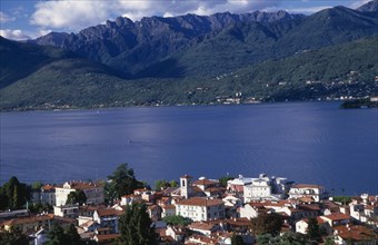 ITALY, Piedmont, Lake Maggiore, Stresa.  View over red tiled rooftops of town towards lake and