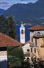 ITALY, Piedmont, Lake Maggiore , Stresa.  Overhanging red tiled rooftops of town buildings with