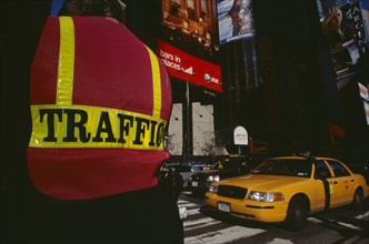 USA, New York, New York City, Times Square.  Traffic police officer wearing florescent jacket