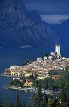 ITALY, Veneto, Lake Garda , Malcesine.  Tiled rooftops and pastel coloured buildings of town and
