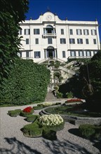 ITALY, Lombardy, Lake Como, Tremezzo.  Exterior facade and formal gardens of the Villa Carlotta.