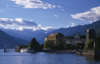 ITALY, Piedmont, Lake Maggiore, "Pallanza.  Lakeside buildings, crowds and moored ferry boat with