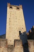 ITALY, Veneto, Lake Garda, Malcesine.  Castello Scaligero fortified tower and crenellated walls.