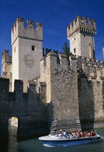 ITALY, Lombardy, Lake Garda , Sirmione.  Part view of crenellated walls and towers of the Rocca