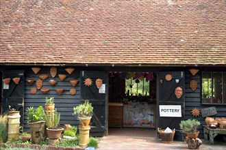 ENGLAND, West Sussex, Amberley, Amberley Working Museum. Pottery building with examples of clay