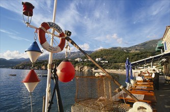 MONTENEGRO, Przno, Waterfront restaurants with fishing nets and nautical decoration looking out