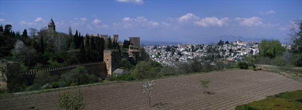 SPAIN, Granada, Alhambra and city roof tops seen from the General Life Gardens