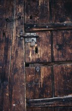 FRANCE, Architectural Detail, "Detail of wooden door of old French farmhouse with bolt, padlock and