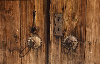 TURKEY, Zonguldak, Safranbolu, Detail of wooden door and traditional metal handle.
