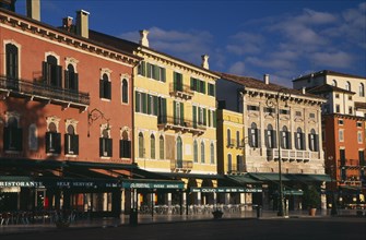 ITALY, Veneto, Verona, Piazza Bra.  Line of empty bars and cafes and painted facades of