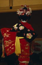 JAPAN, People, Children, "Young girl seen from behind, wearing traditional red embroidered kimono