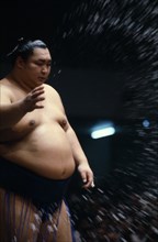 JAPAN, Samurai, Sumo, Sumo wrestler throwing handfuls of salt into the ring as an act of