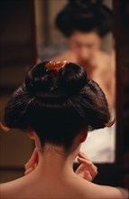 JAPAN, Customs, Geisha, "Head of geisha seen from behind to show hairstyle with mirror reflection