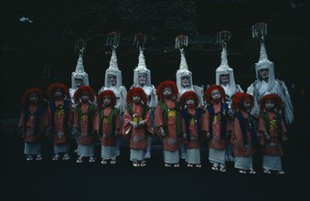 JAPAN, Honshu, Kyoto, Gion Festival.  Children dressed for Shinto dances pose for photographer at