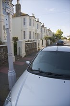 ENGLAND, West Sussex, Worthing, View over car bonnet parked next to lamp post with Permit holders