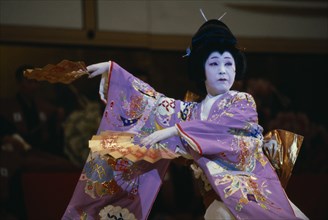 JAPAN, Honshu, Tokyo, Use of traditional Geisha dances in modern choreography.  Female dancer with
