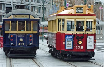 NEW ZEALAND, SOUTH ISLAND, CHRISTCHURCH, "CANTERBURY, CITY TOUR TRAMS AT A TRAM STOP IN CATHEDRAL
