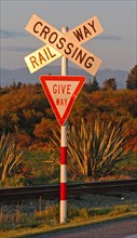 NEW ZEALAND, SOUTH ISLAND, WEST COAST, "HOKITIKA, RAILWAY LEVEL CROSSING ROAD SIGN ON THE WESTERN