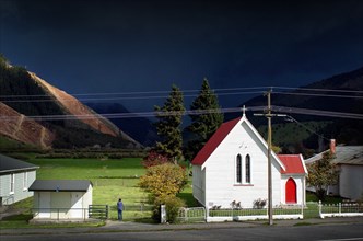 NEW ZEALAND, SOUTH ISLAND, CANVASTOWN, A STORM APPROACHES THE LOCAL CHURCH AT CANVASTOWN VIEWED