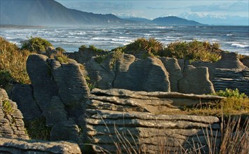 NEW ZEALAND, SOUTH ISLAND, PUNAKAIKI, "GEOLOGICAL FEATURED ROCKS CALLED THE PANCAKE ROCKS BLOWHOLES