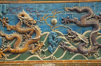 CHINA, Beijing, "Beihai Park.  Detail of Nine Dragon Screen constructed from coloured, glazed tiles