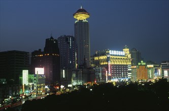 CHINA, Shanghai, "Renmin Square or the People’s Square at night, with buildings illuminated with
