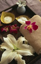 CHINA, Beijing, "Bodhi Therapeutic Retreat.  Tray with creams and lotions, folded towel and lilly