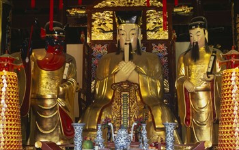 CHINA, Shanghai, "Yu Gardens, Temple of the City of God.  Three golden statues behind small altar.