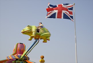 ENGLAND, West Sussex, Littlehampton, Families enjoying amusement ride at Harbour Park. British