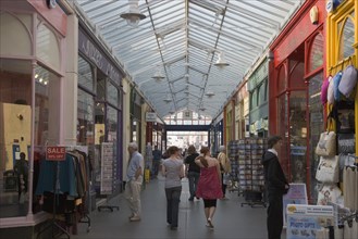 ENGLAND, West Sussex, Bognor Regis, Interior of The Bognor Arcade with people walking through