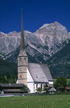 AUSTRIA, Salzburg, Maria Alm am Steinernen Meer, "Parish church exterior with long, narrow spire