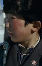 MONGOLIA, Children, Altai provincial capital  Portrait of young boy with Mongolian Communist Party