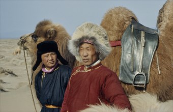 MONGOLIA, People, Bigersum negdel collective  Khalkha father and son in fleece-lined winter