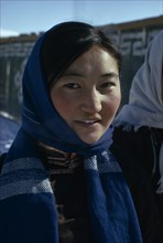 MONGOLIA, People, Altai provincial capital in winter. Head and shoulders portrait of young woman