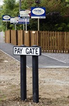 ENGLAND, West Sussex, Washington, To Let and For Sale signs on wooden fencing outside a newly built