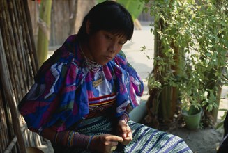 PANAMA, San Blas Islands, Kuna Indians, Kuna Indian girl wearing brightly coloured blouse or