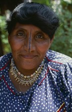 PANAMA, San Blas Islands, Kuna Indians, Portrait of  wife of Kuna headman traditional black stripe