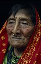 PANAMA, San Blas Islands, Kuna Indians, Head and shoulders portrait of elderly Kuna woman wearing