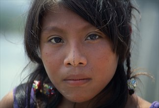 PANAMA, San Blas Islands, Kuna Indians, Head and shoulders portrait of young Kuna girl with remnant