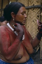 COLOMBIA, North West Amazon, Tukano Indigenous People,  Barasana woman  Paulina  using cumare fibre