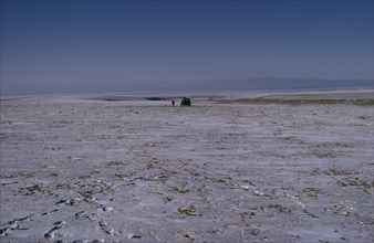 MONGOLIA, Gobi Desert, Mid-winter on the edge of the Gobi with a distant Russian Gaz jeep and lone