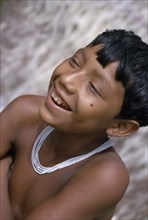 COLOMBIA, North West Amazon, Tukano Indigenous People, Head and shoulders portrait of laughing