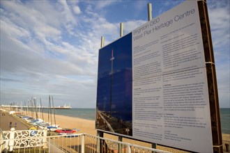 ENGLAND, East Sussex, Brighton, Ruins of the West pier with boards showing plans for the i360